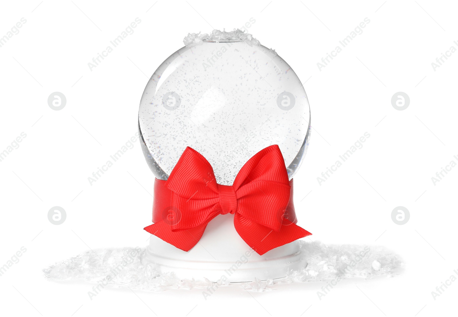 Photo of Magical empty snow globe with red bow on white background