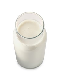 Glass carafe of fresh milk isolated on white, above view