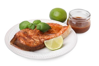 Fresh marinade, cooked fish, lime and basil isolated on white