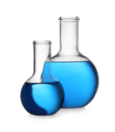 Photo of Florence flasks with blue liquid on white background. Laboratory glassware