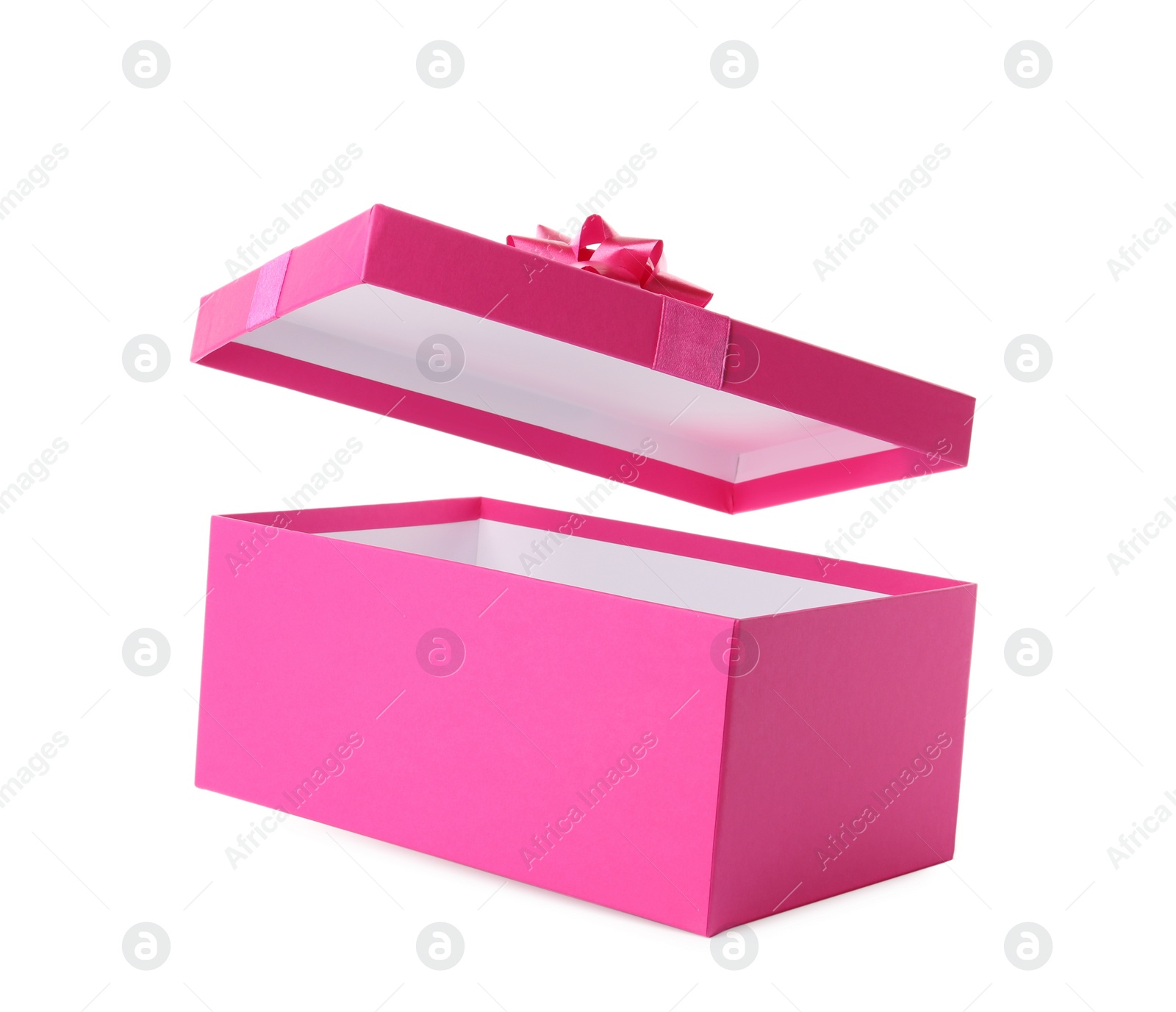Photo of Pink gift box and lid with bow on white background