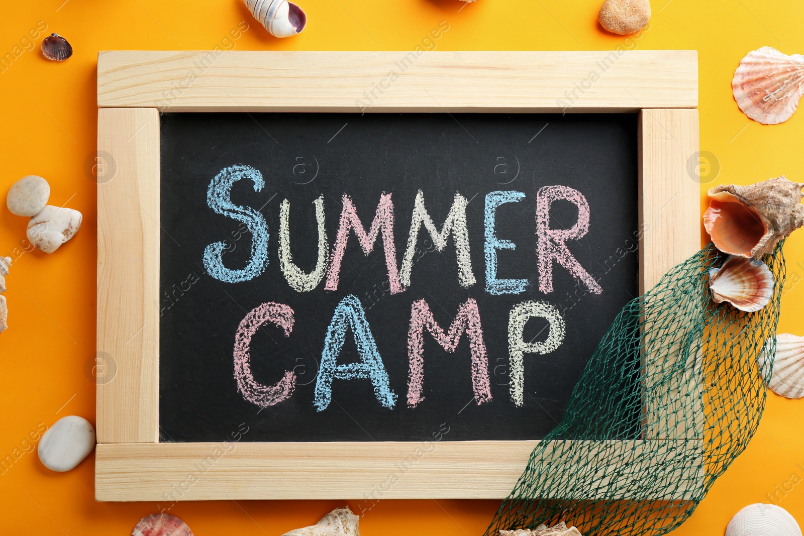 Photo of Text "SUMMER CAMP" on chalkboard, top view