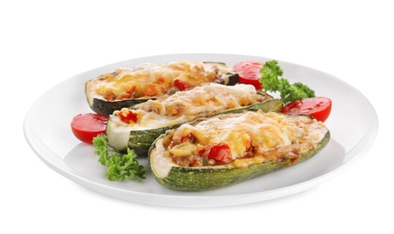 Photo of Tasty baked stuffed zucchinis on white background