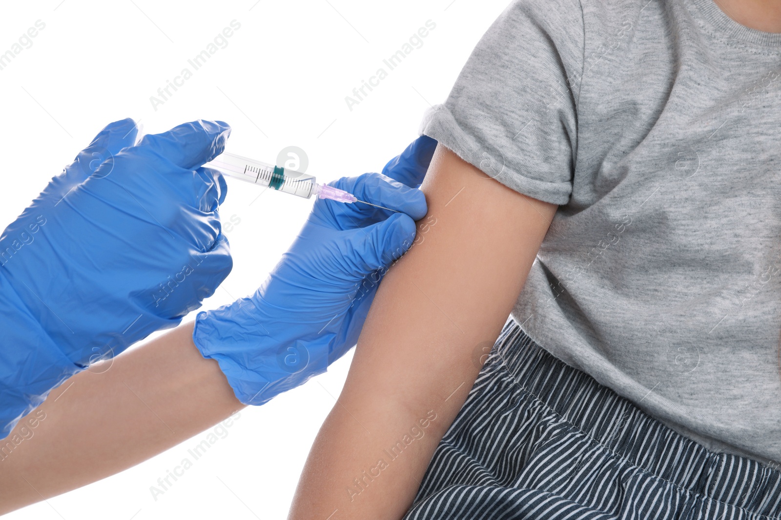 Photo of Little girl receiving chickenpox vaccination on white background, closeup. Varicella virus prevention