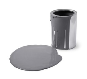 Photo of Spilled grey paint and can on white background