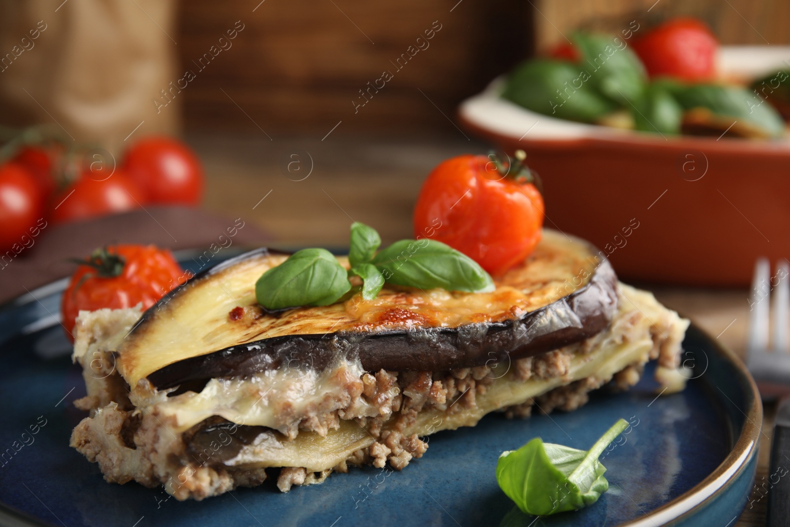 Photo of Plate of delicious eggplant lasagna on table, closeup