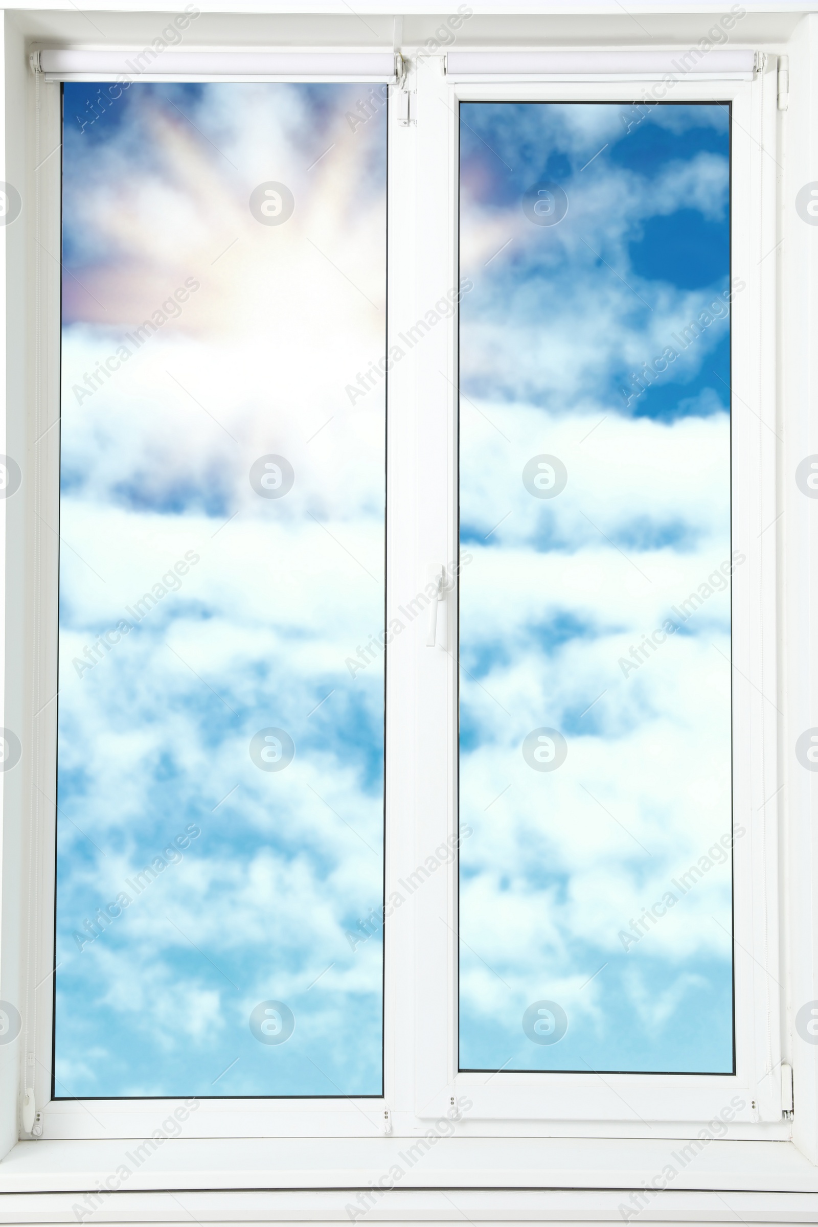 Image of Beautiful view on blue sky with clouds through window