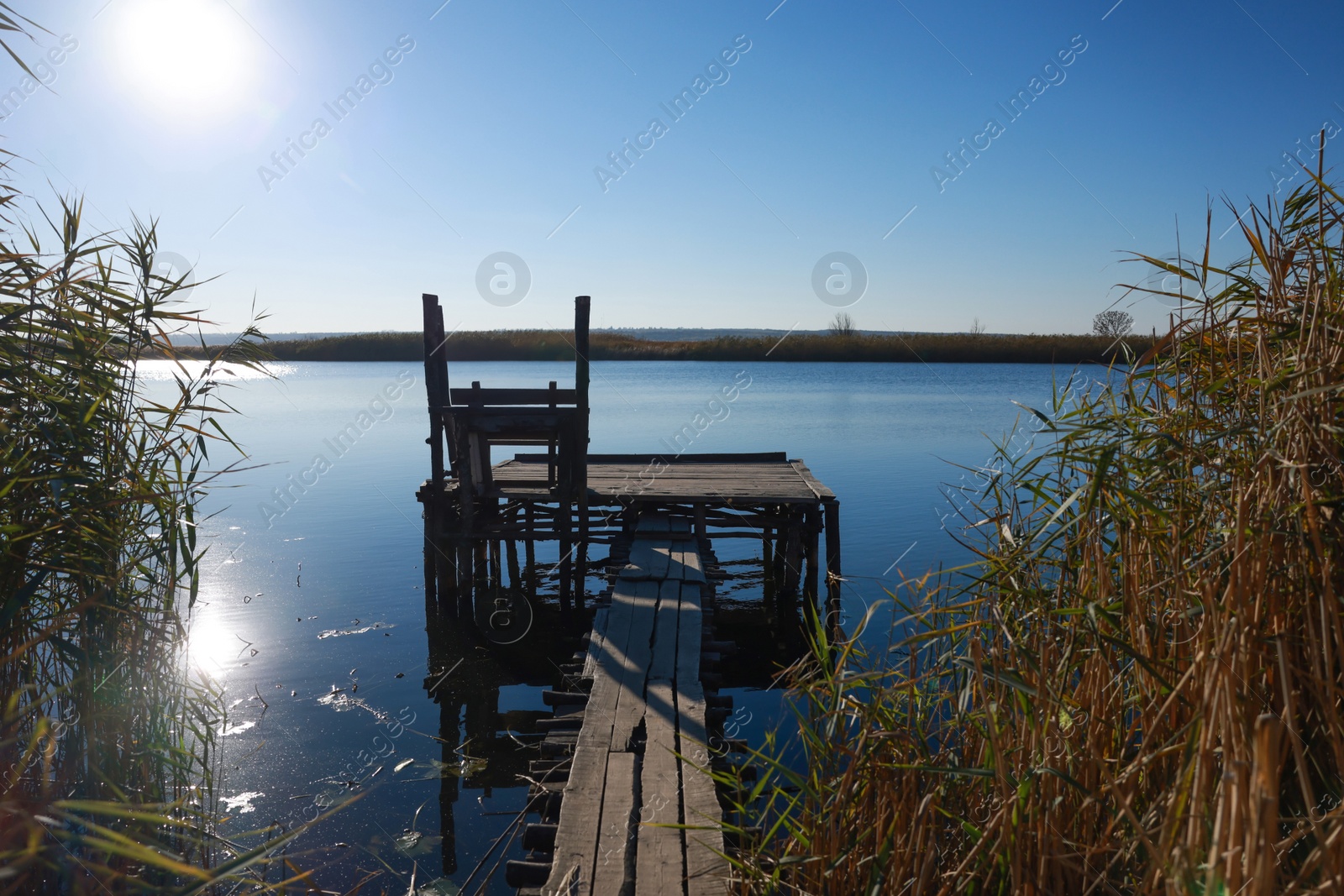 Photo of Beautiful view of river with wooden pier on sunny day