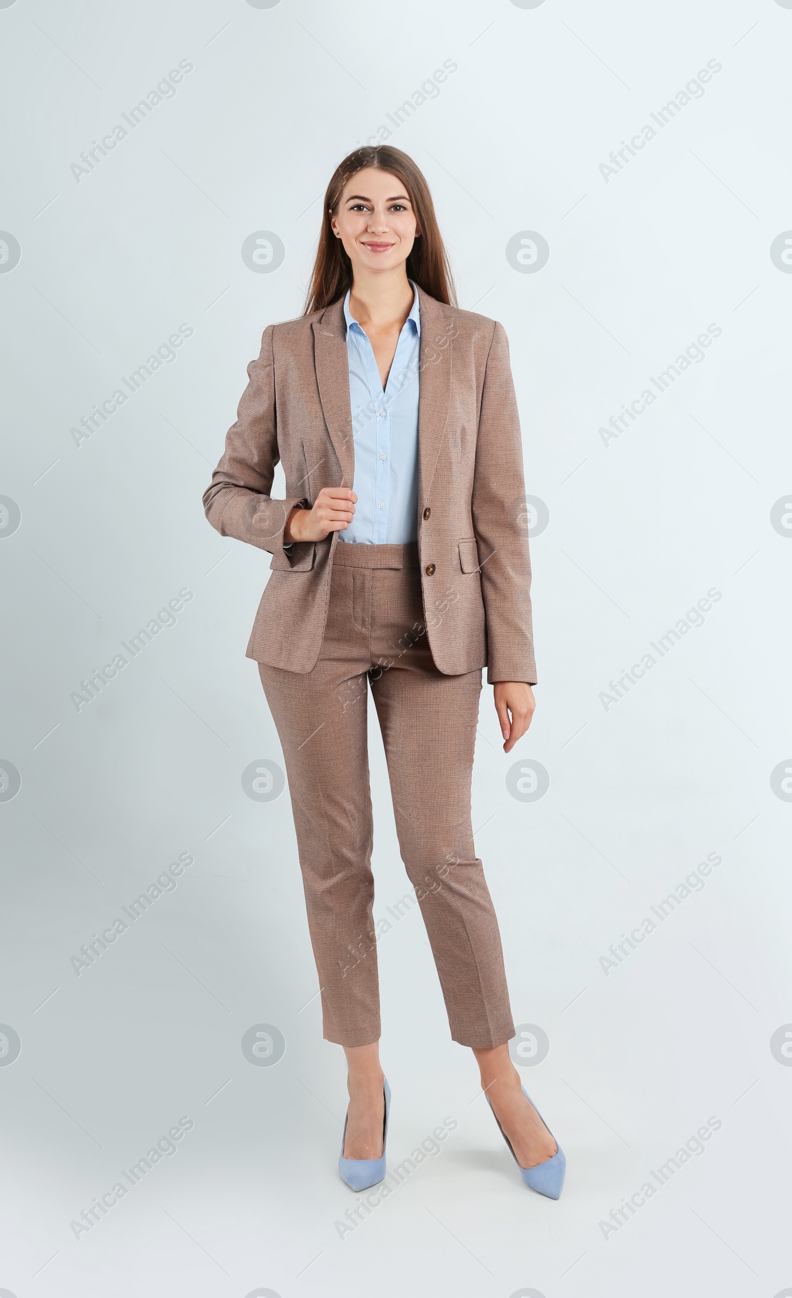 Photo of Full length portrait of beautiful young businesswoman on white background