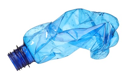 Photo of Crumpled disposable plastic bottle isolated on white