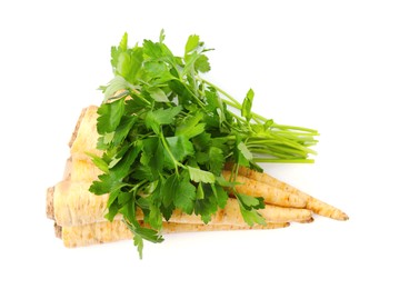 Raw parsley roots and bunch of fresh herb isolated on white, top view