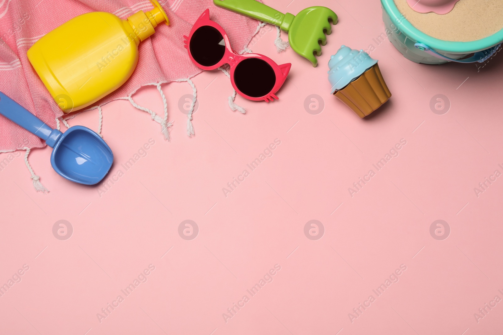 Photo of Flat lay composition with beach toys on color background. Space for text