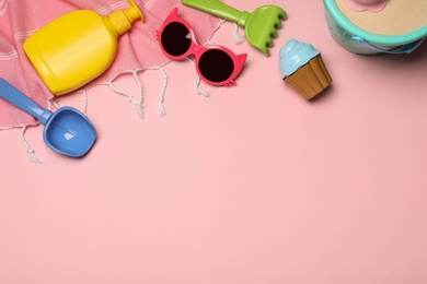 Photo of Flat lay composition with beach toys on color background. Space for text