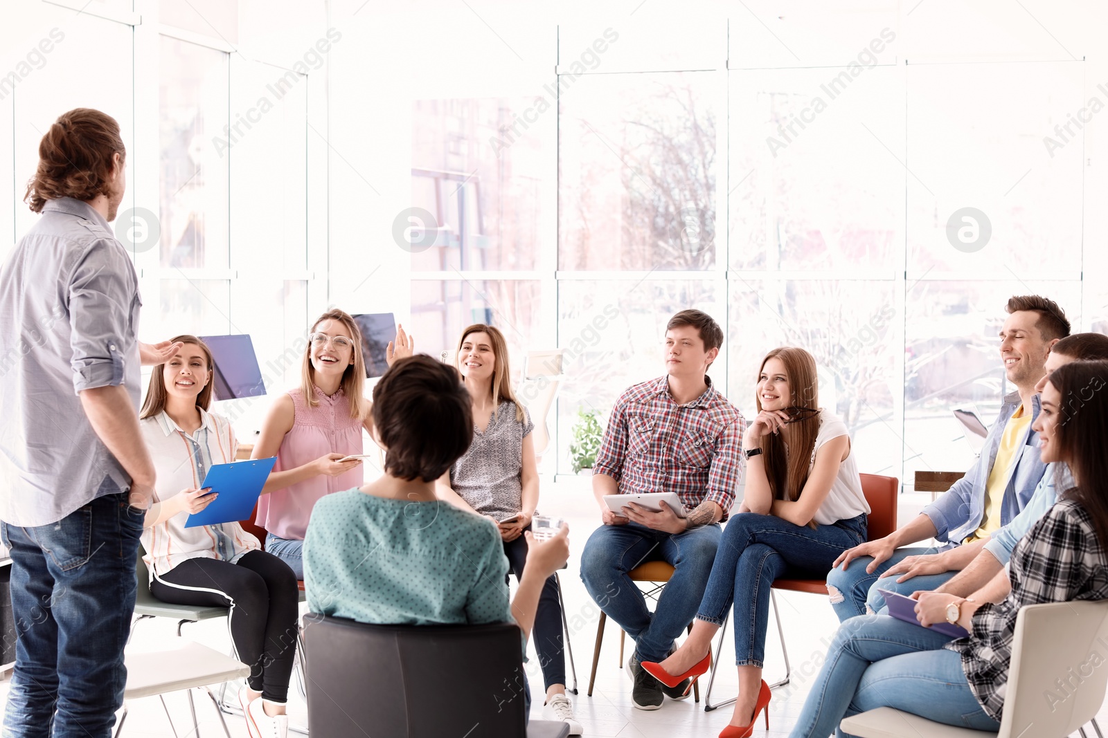 Photo of Male business trainer giving lecture in office