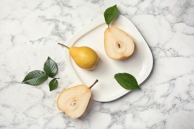 Photo of Flat lay composition with ripe pears on marble background