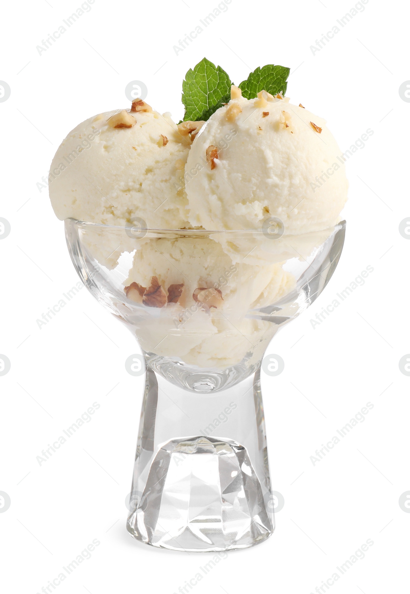 Photo of Glass dessert bowl of tasty vanilla ice cream with mint and nuts isolated on white