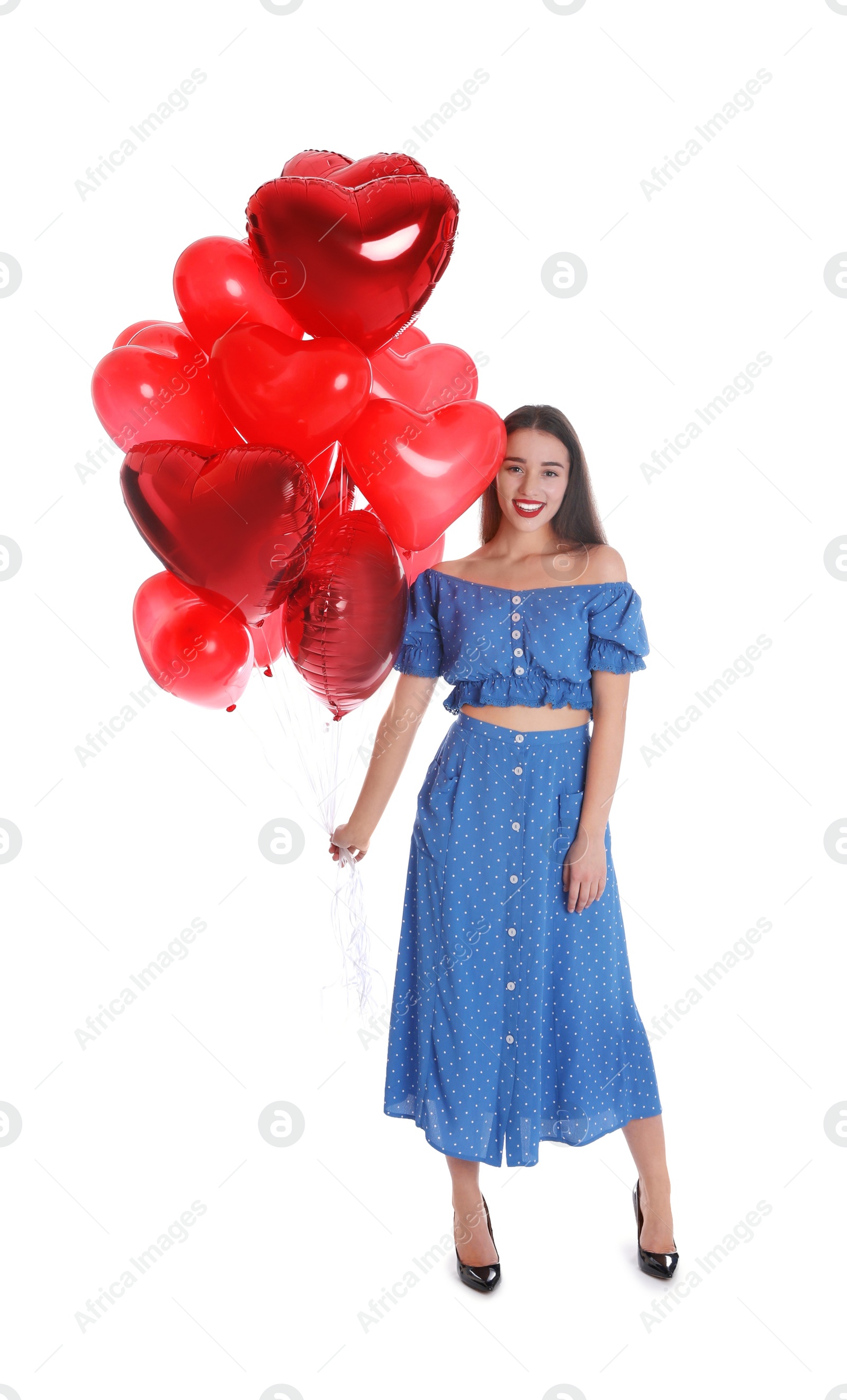 Photo of Beautiful young woman with heart shaped balloons isolated on white. Valentine's day celebration