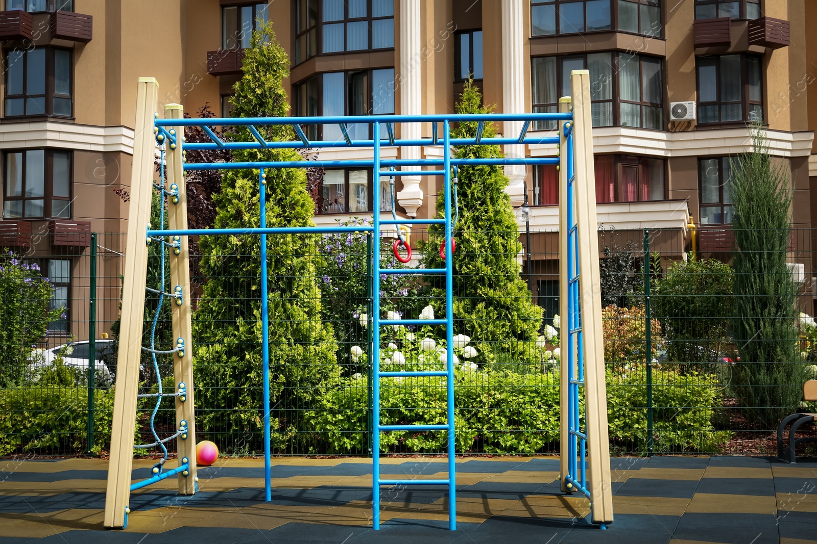 Photo of Empty monkey bars on outdoor children's playground in residential area