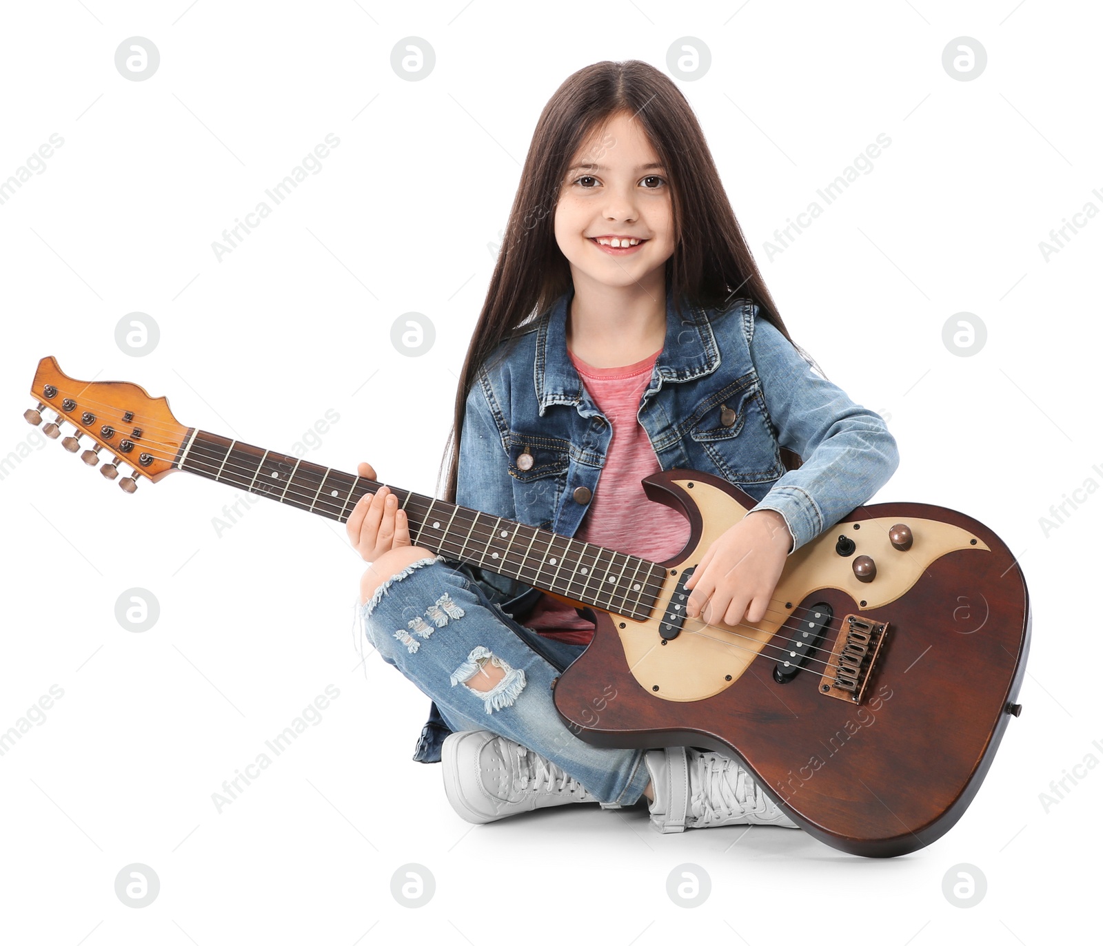 Photo of Little cheerful girl playing guitar, isolated on white