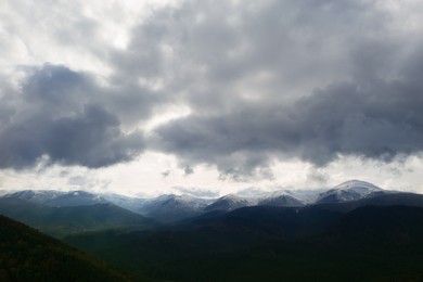 Image of Aerial view of beautiful forest in mountains on autumn day