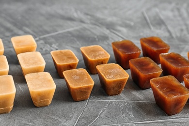 Photo of Composition with coffee ice cubes on grey table