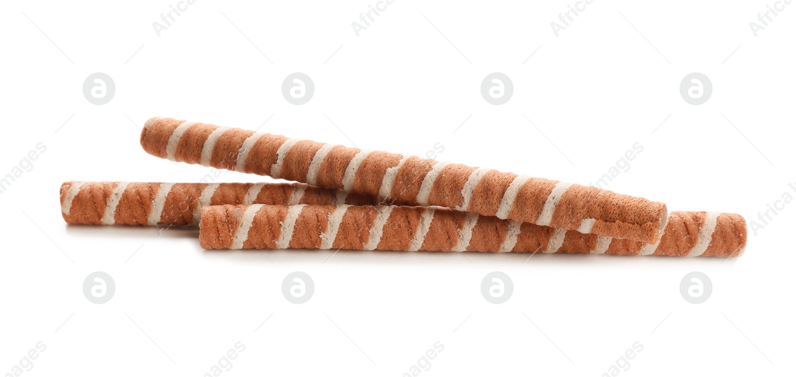 Photo of Tasty wafer roll sticks on white background. Crispy food