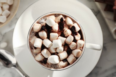 Cup of aromatic hot chocolate with marshmallows on table, top view