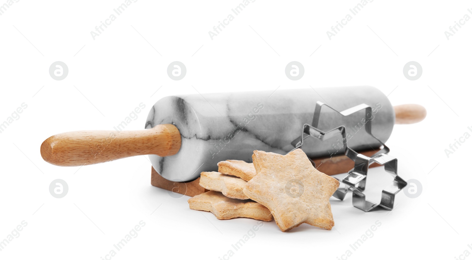 Photo of Tasty homemade Christmas cookies, cutters and rolling pin on white background