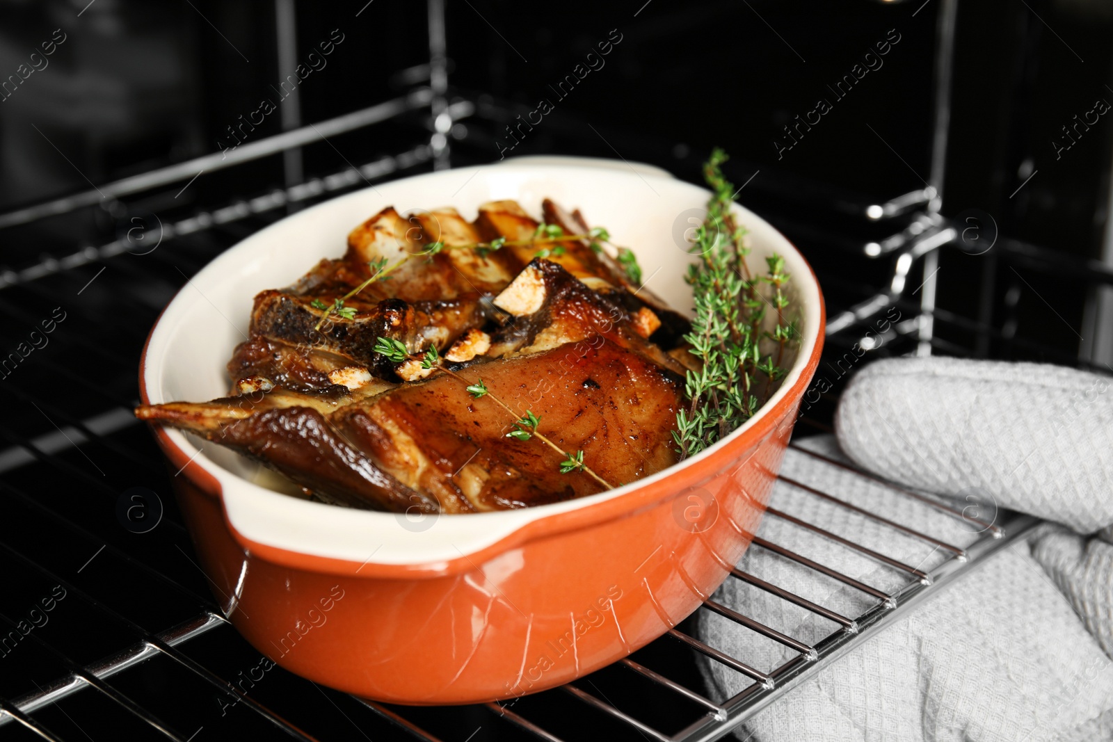 Photo of Delicious roasted ribs with thyme in oven