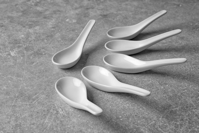 Photo of Clean Miso soup spoons on grey background