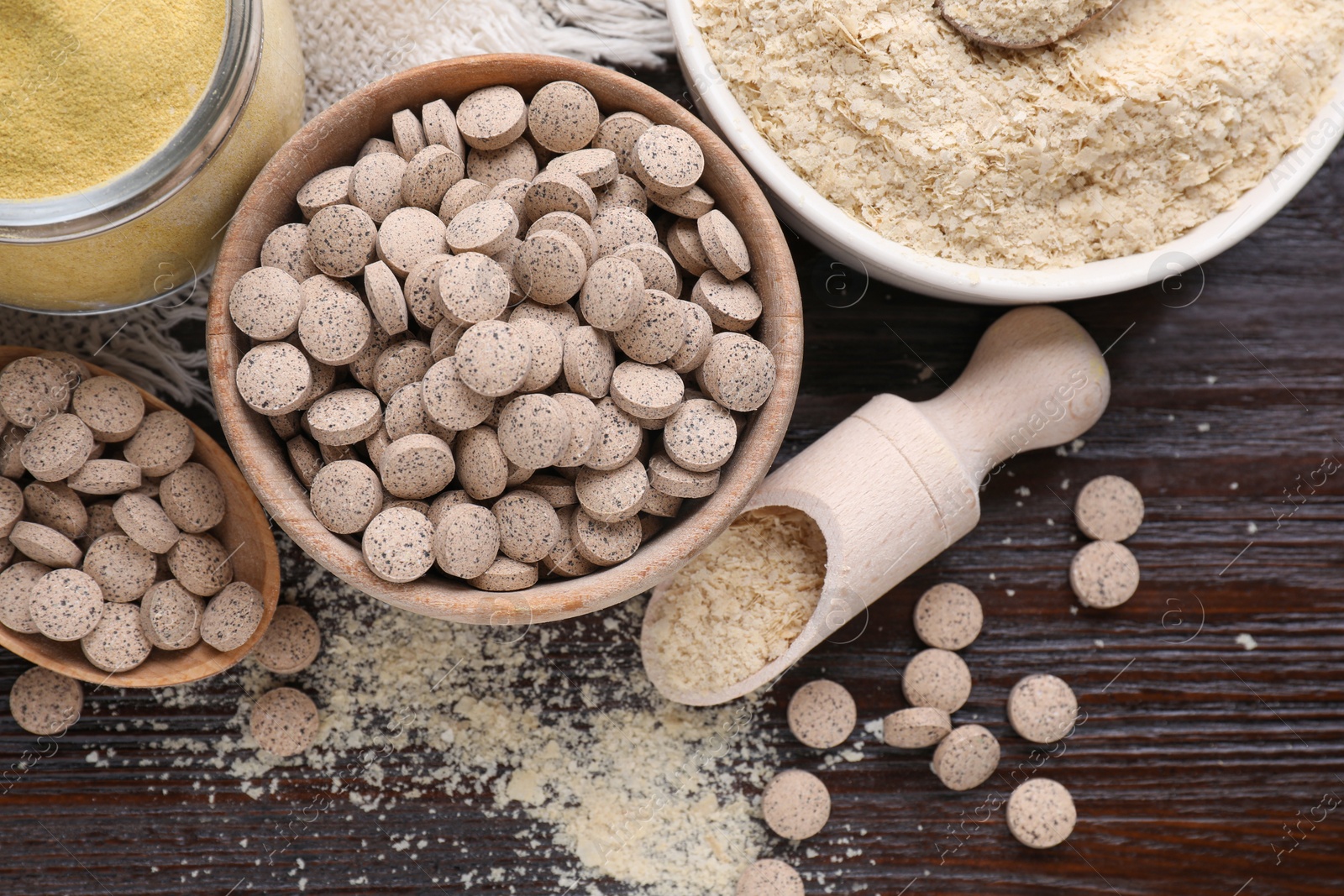 Photo of Flat lay composition with different types of brewer`s yeast on wooden table