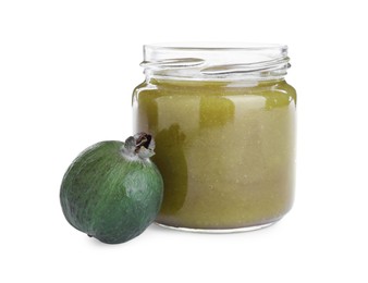 Photo of Feijoa jam in glass jar and fresh fruit on white background