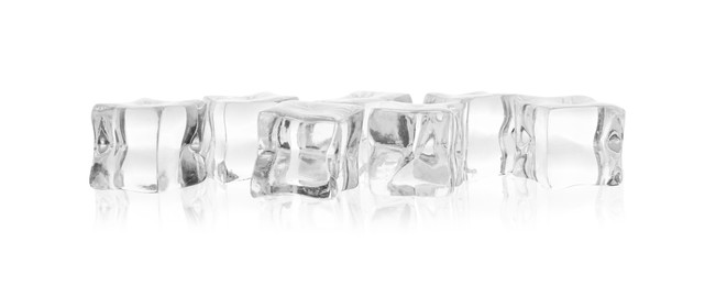 Many crystal clear ice cubes isolated on white