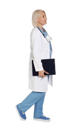 Photo of Full length portrait of female doctor with clipboard isolated on white. Medical staff