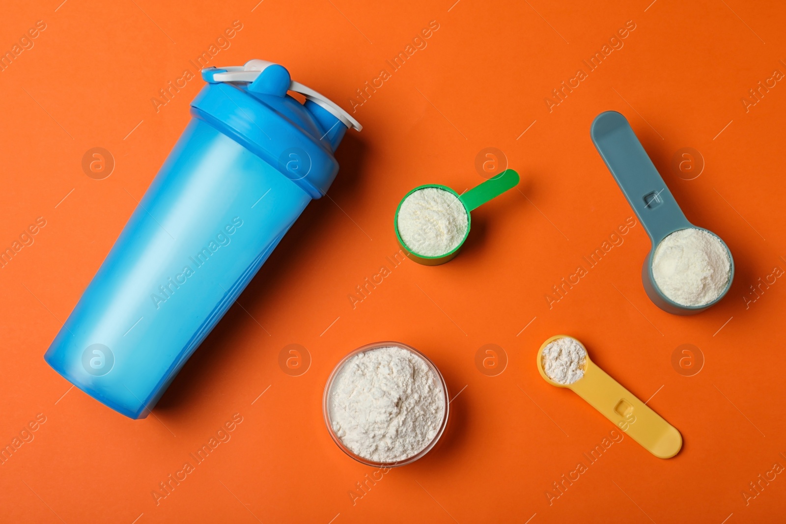 Photo of Flat lay composition with protein powder on color background