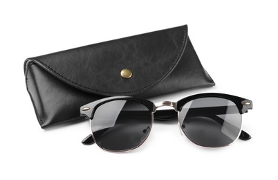 Photo of Modern sunglasses and black case on white background