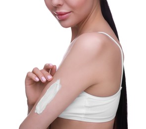 Woman with smear of body cream on her arm against white background, closeup