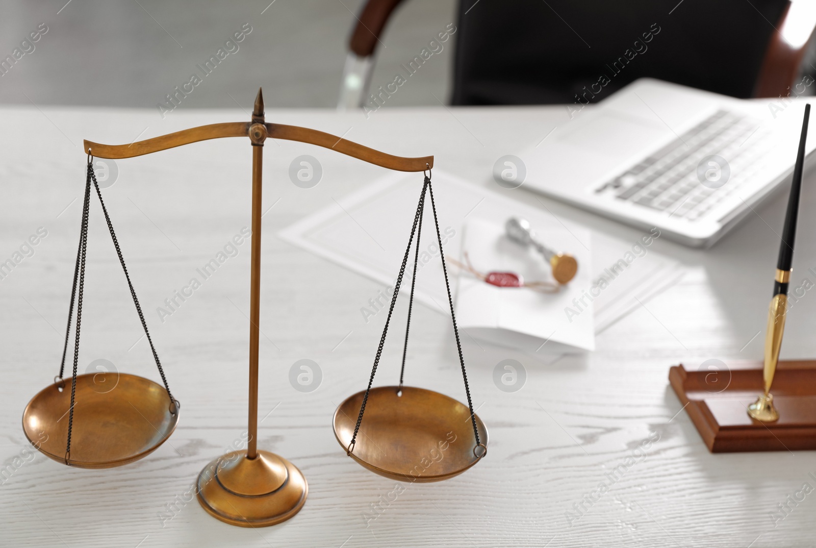 Photo of Scales of justice on desk in notary's office