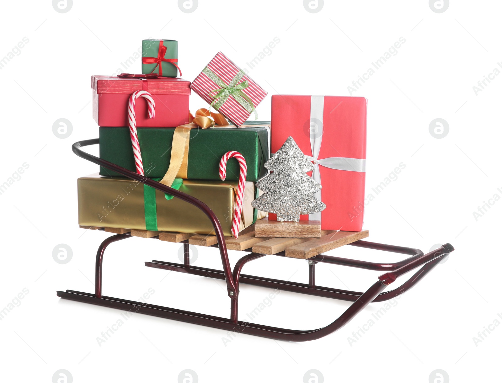 Photo of Sleigh with Christmas gifts on white background