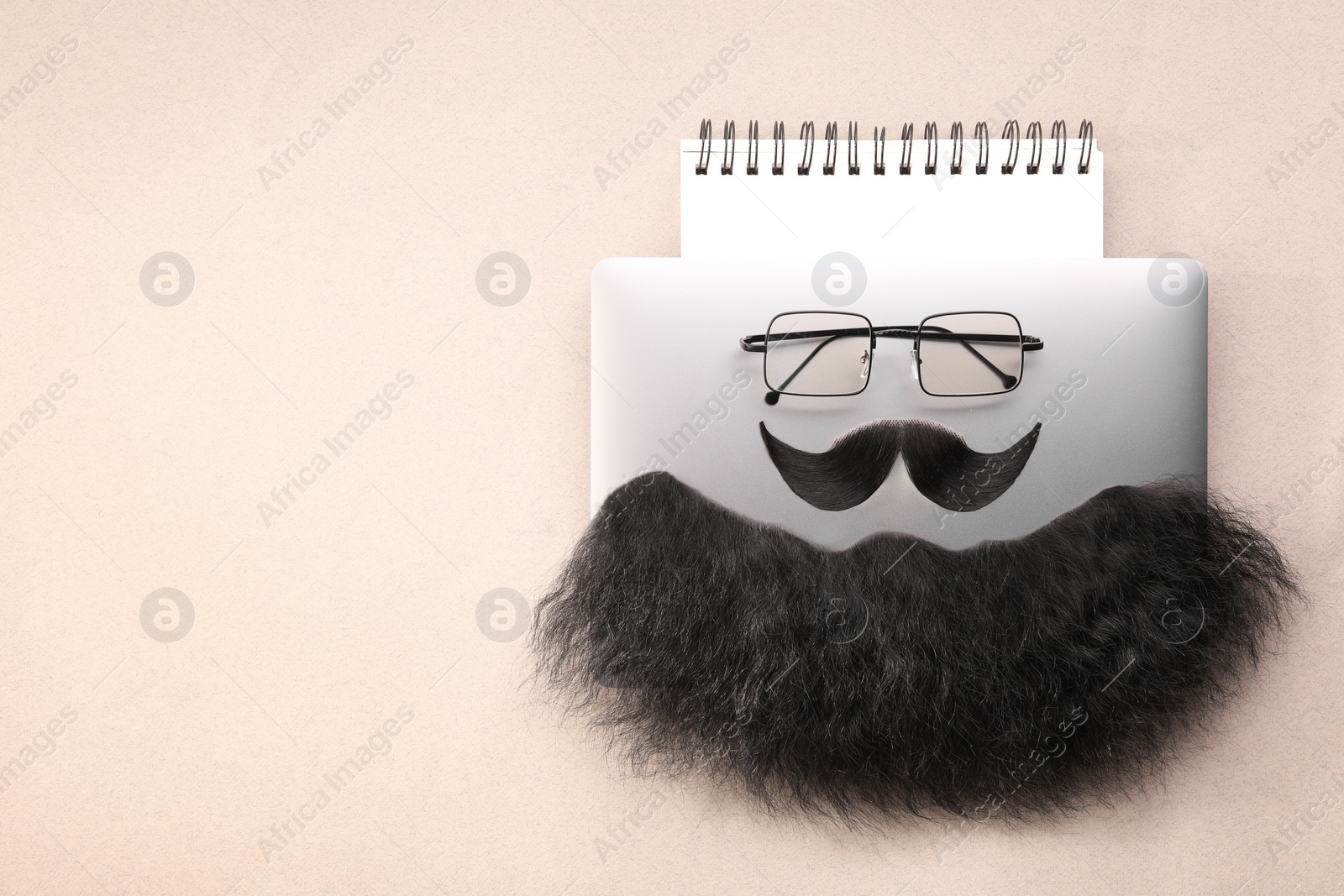 Photo of Flat lay composition with artificial moustache and glasses on light brown background, space for text