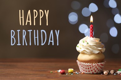 Happy Birthday! Delicious cupcake with candle on wooden table