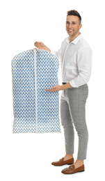 Photo of Man holding garment cover with clothes on white background. Dry-cleaning service