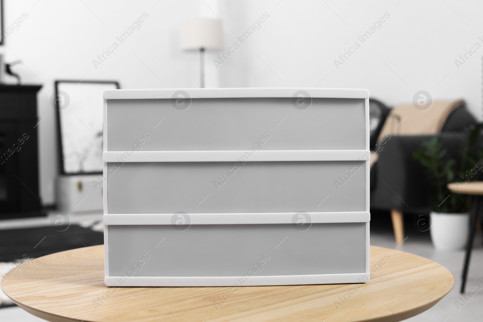 Photo of Blank letter board on wooden table indoors