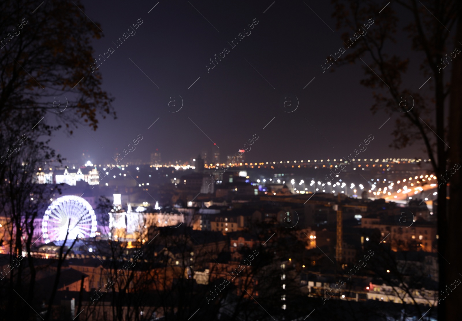 Photo of Panoramic view of modern night city. Bokeh effect