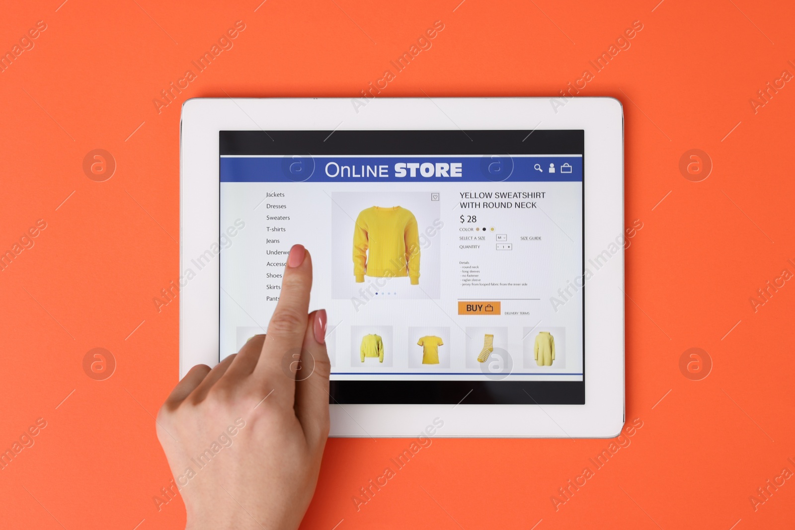 Photo of Woman with tablet shopping online on orange background, top view