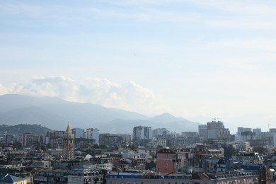 Picturesque view of modern city near mountains