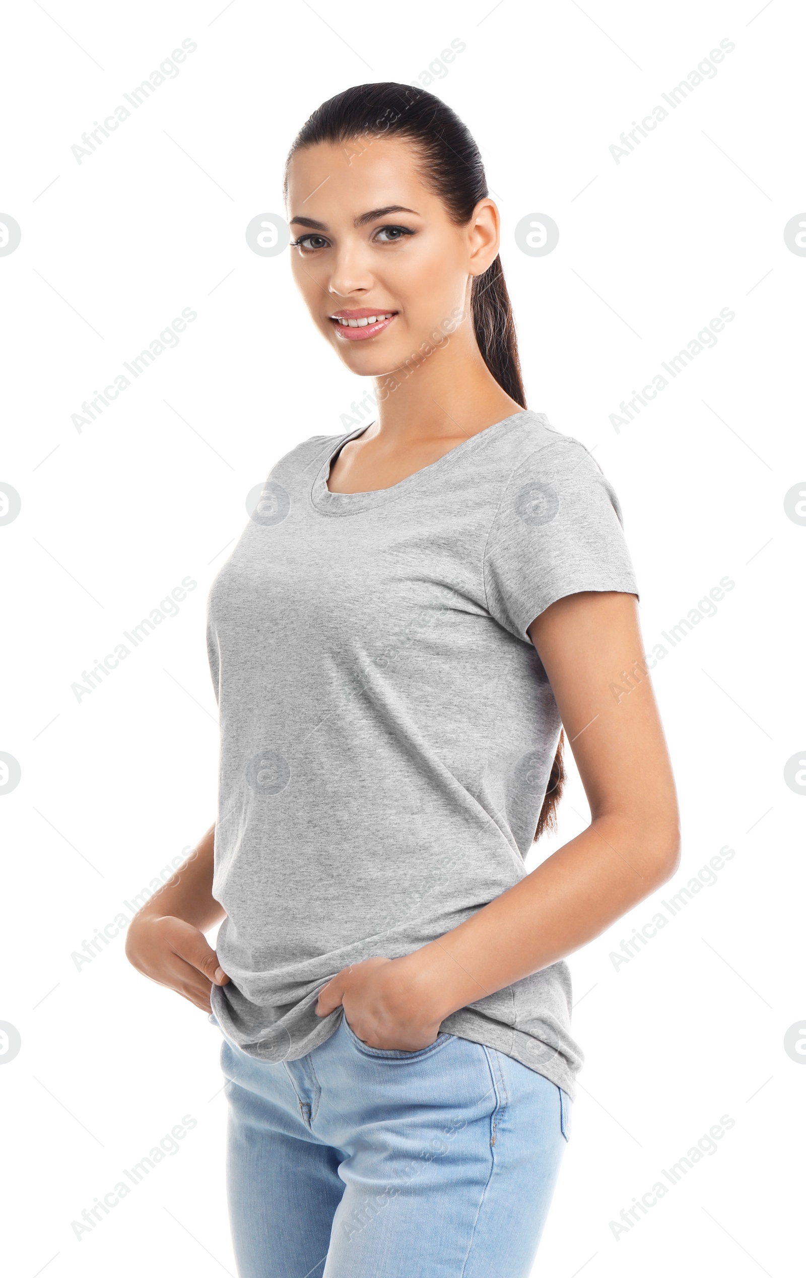 Photo of Young woman in t-shirt on white background. Mockup for design