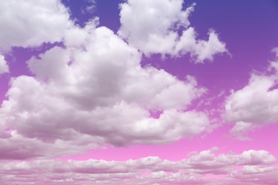 Image of Picturesque pink and purple sky with fluffy clouds