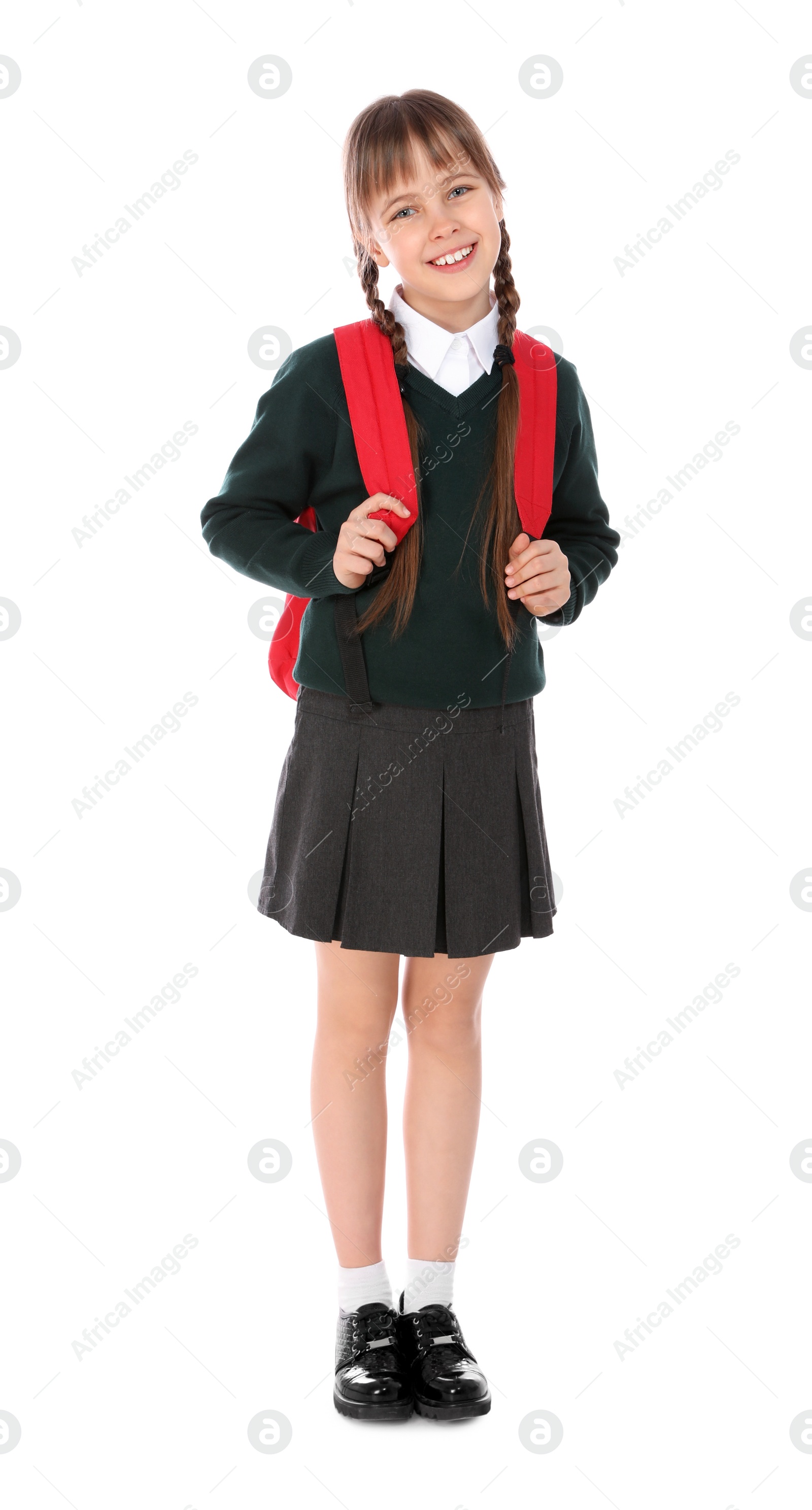 Photo of Full length portrait of cute girl in school uniform with backpack on white background