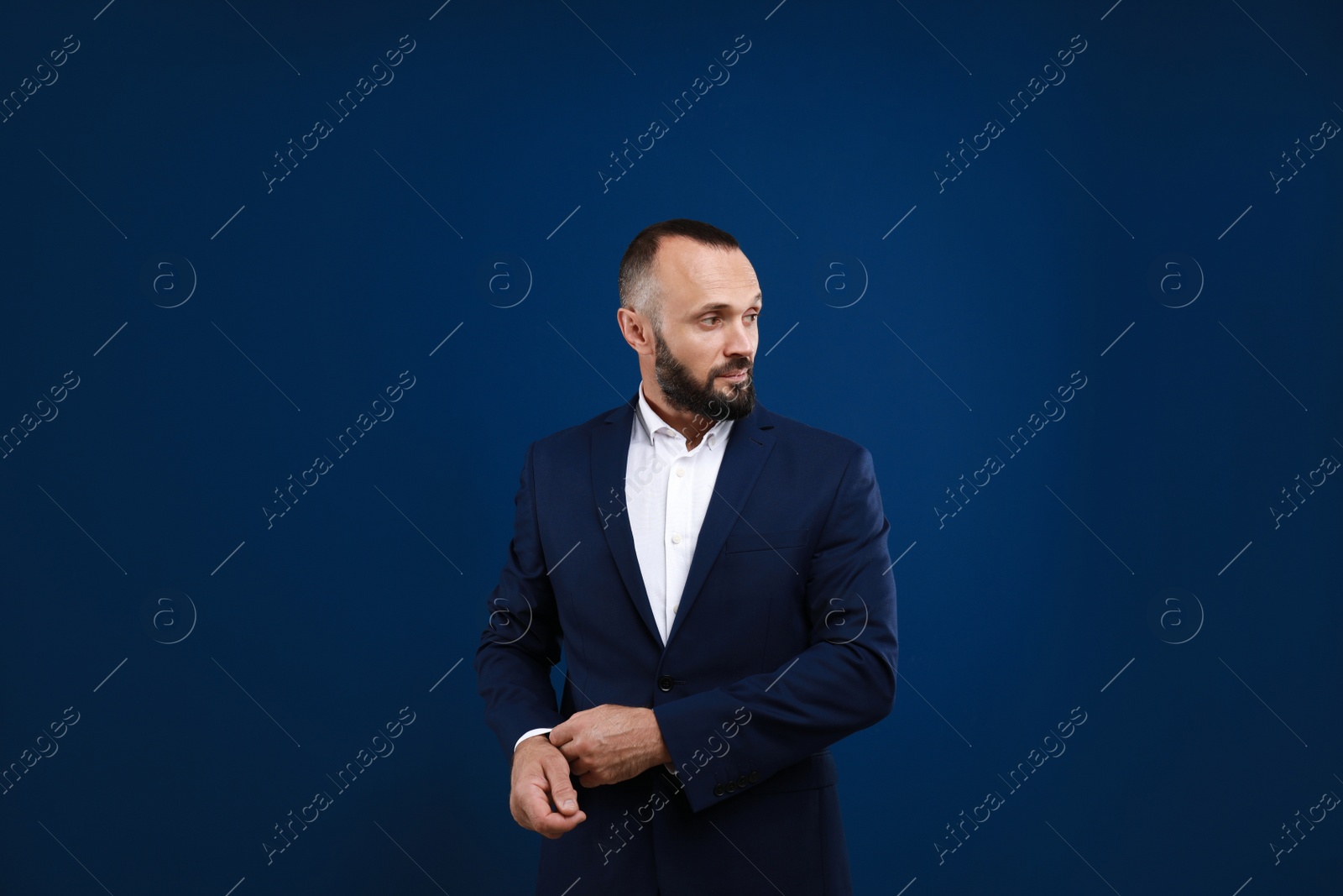 Photo of Portrait of handsome man on blue background